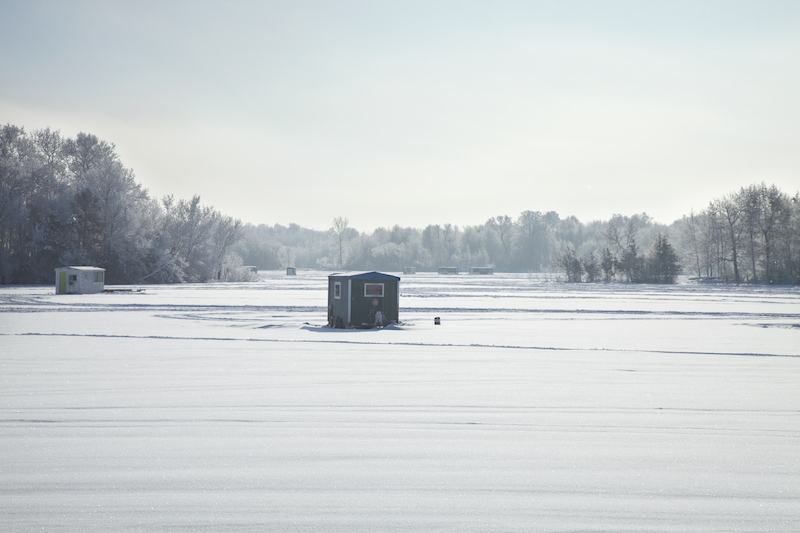https://www.hermannins.com/wp-content/uploads/2023/11/ice-fishing-houses-at-a-minnesota-lake-on-a-bright-2021-08-27-09-56-50-utc.jpg